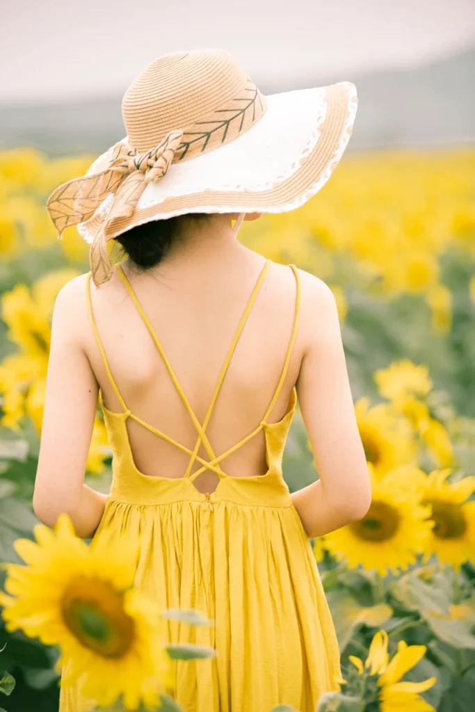 woman wearing a maxi yellow gown for Kibbe scale.